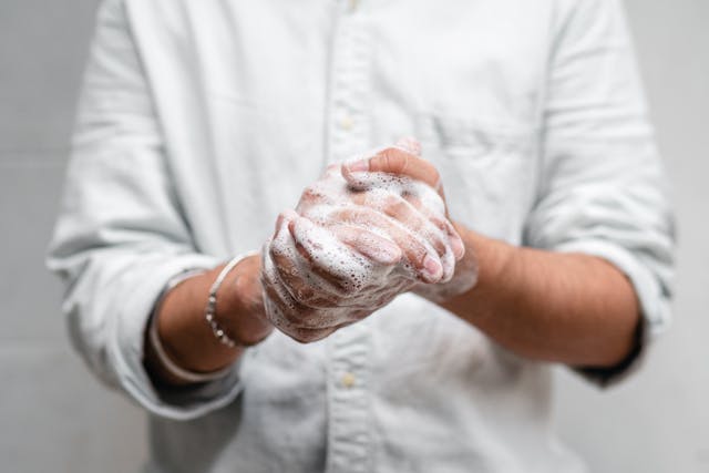 person washing their hands